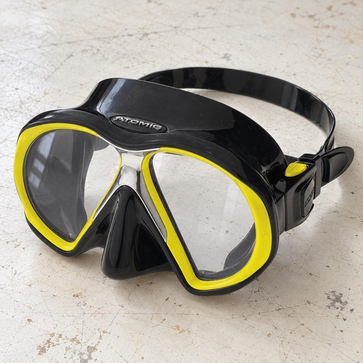 Open Box Atomic Aquatics SubFrame Mask, Medium Fit — Black/Yellow, open box, lightly used on off-white work table