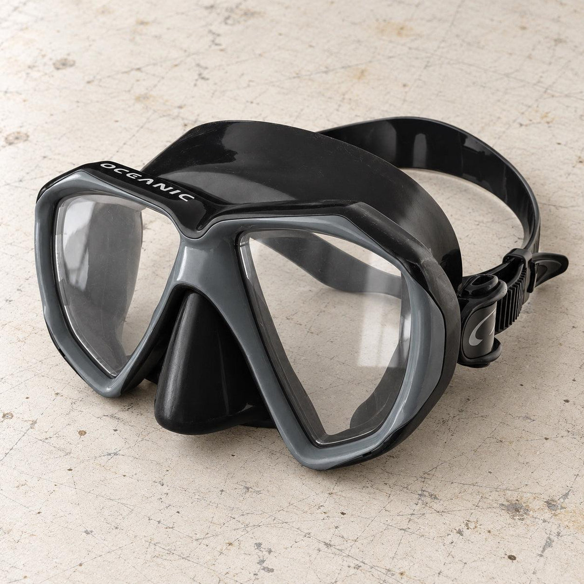 Open Box Oceanic Duo Mask — Black/Titanium, open box, lightly used on off-white work table