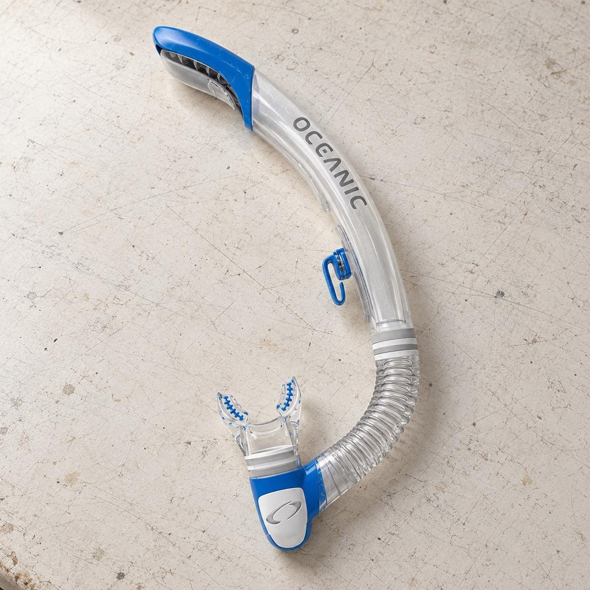 Open Box Oceanic Ultra SD Snorkel — Clear/Blue, open box, lightly used on off-white work table