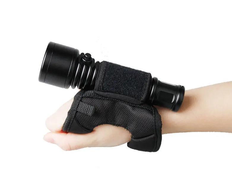 OrcaTorch WS01 wrist strap holding a dive light on the hand