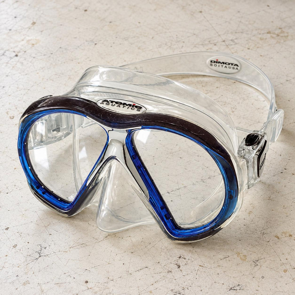 Open Box Atomic Aquatics SubFrame Mask, Medium Fit — Clear/Blue, open box, lightly used on off-white work table