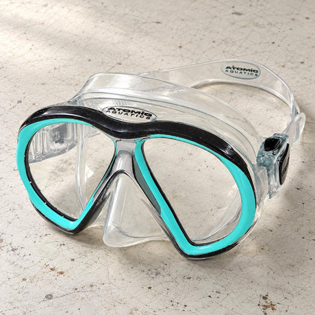 Open Box Atomic Aquatics SubFrame Mask, Medium Fit — Clear/Aqua, open box, lightly used on off-white work table