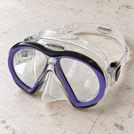 Open Box Atomic Aquatics SubFrame Mask, Medium Fit — Clear/Purple, open box, lightly used on off-white work table