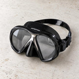 Open Box Atomic Aquatics SubFrame Mask, Medium Fit — Black/Black, open box, lightly used on off-white work table