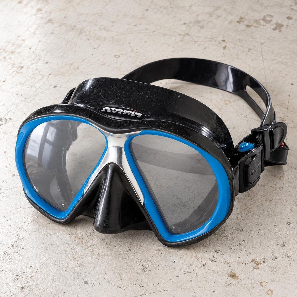Open Box Atomic Aquatics SubFrame Mask, Medium Fit — Black/Royal Blue, open box, lightly used on off-white work table