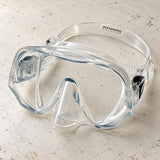 Open Box Atomic Aquatics Frameless Mask — Clear, open box, lightly used on off-white work table