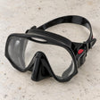 Open Box Atomic Aquatics Frameless Mask — Black, open box, lightly used on off-white work table