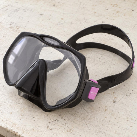 Open Box Atomic Aquatics Frameless Mask — Black/Pink, open box, lightly used on off-white work table