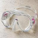 Open Box Atomic Aquatics Frameless Mask — Clear/Pink, open box, lightly used on off-white work table