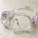 Open Box Atomic Aquatics Frameless Mask — Clear/Purple, open box, lightly used on off-white work table