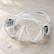Open Box Atomic Aquatics Frameless 2 Mask — Clear, open box, lightly used on off-white work table
