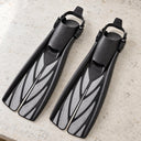 Open Box Atomic Aquatics Open Heel Fin — Silver, open box, lightly used on off-white work table