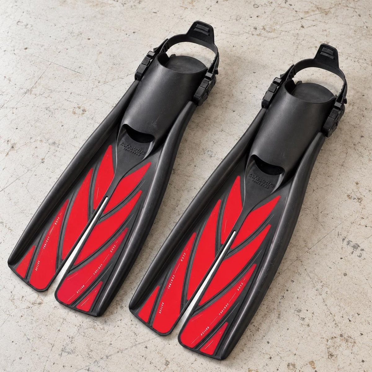 Open Box Atomic Aquatics Open Heel Fin — Red, open box, lightly used on off-white work table