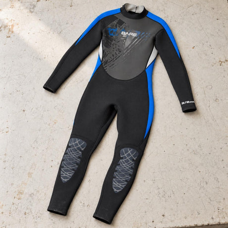 Open Box Bare 3/2mm Manta Full Wetsuit, Youth — Blue, open box, lightly used on off-white work table
