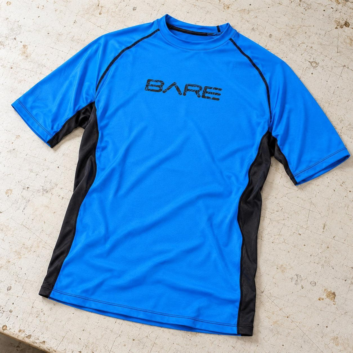 Open Box Bare Sunguard, Short Sleeve, Mens — Blue, open box, lightly used on off-white work table
