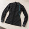 Open Box Bare EXOWEAR Jacket Womens — Black, open box, lightly used on off-white work table