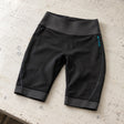 Open Box Bare EXOWEAR Shorts Womens — Black, open box, lightly used on off-white work table