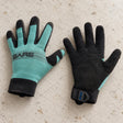 Open Box Bare 2mm Tropic Pro Dive Gloves — Aqua, open box, lightly used on off-white work table