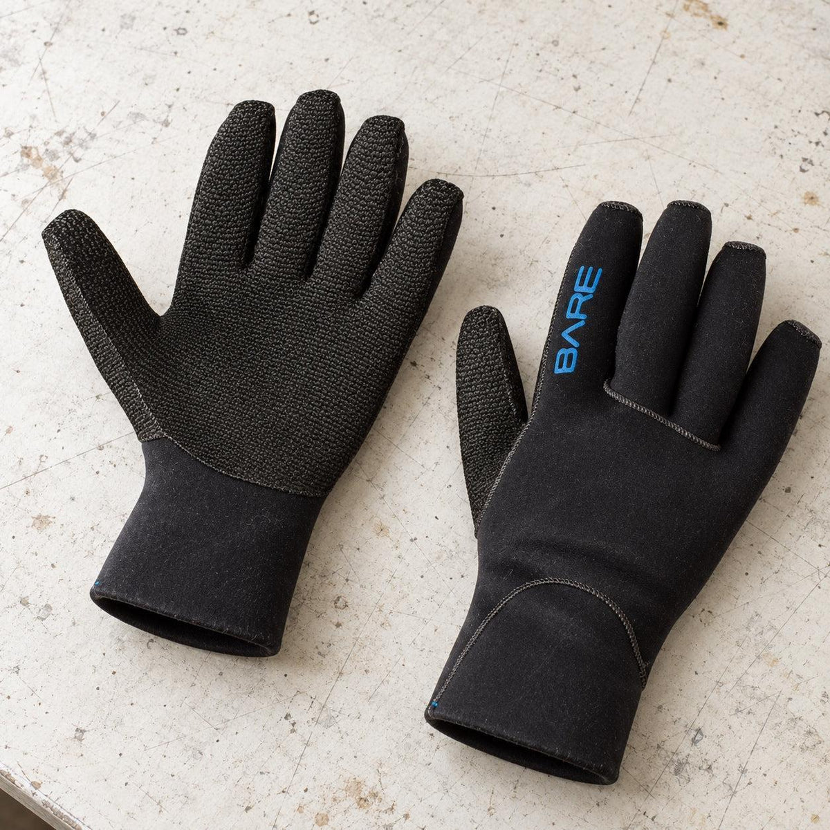 Open Box BARE 3mm K-Palm Dive Gloves — Black, open box, lightly used on off-white work table