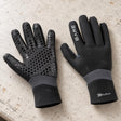 Open Box Bare 3mm Ultrawarmth Dive Gloves — Black, open box, lightly used on off-white work table