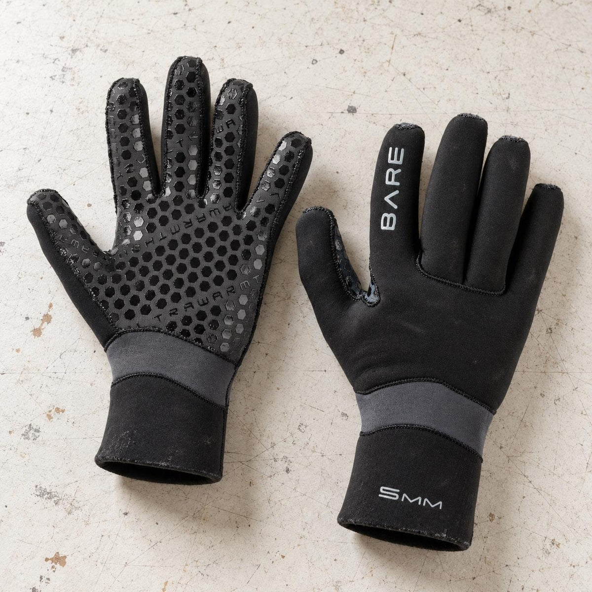 Open Box Bare 5mm Ultrawarmth Dive Gloves — Black, open box, lightly used on off-white work table