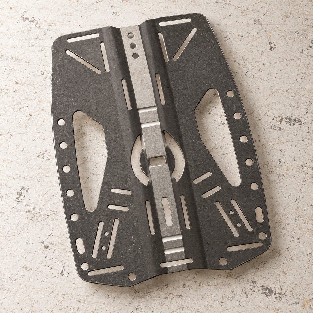 Open Box Hollis Stainless Steel Backplate 2.0 BCD Accessory — default, open box, lightly used on off-white work table