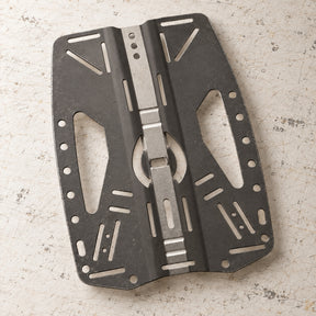 Open Box Hollis Stainless Steel Backplate 2.0 BCD Accessory — default, open box, lightly used on off-white work table