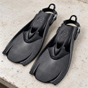 Open Box Hollis Scuba Diving F-1 Bat Fin — Black, open box, lightly used on off-white work table