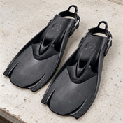 Open Box Hollis Scuba Diving F-1 Bat Fin — Black, open box, lightly used on off-white work table