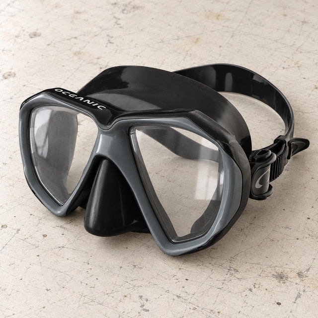 Open Box Oceanic Duo Mask — Black/Titanium, open box, lightly used on off-white work table
