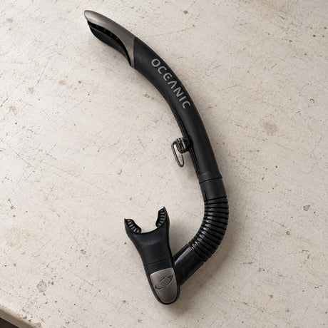 Open Box Oceanic Ultra SD Snorkel — Black/Titanium, open box, lightly used on off-white work table