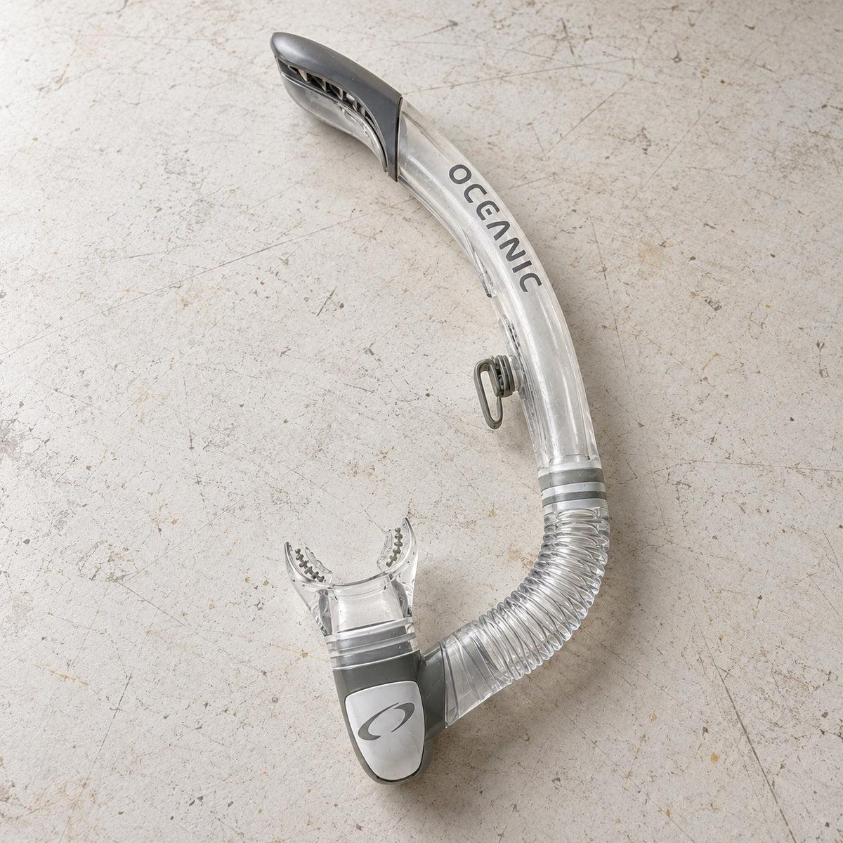 Open Box Oceanic Ultra SD Snorkel — Clear/Titanium, open box, lightly used on off-white work table