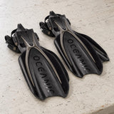 Open Box Oceanic Manta Ray Fin — Titanium/Black, open box, lightly used on off-white work table