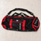 Open Box Stahlsac 26 Mesh Duffle — Red, open box, lightly used on off-white work table