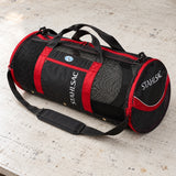 Open Box Stahlsac 26 Mesh Duffle — Red, open box, lightly used on off-white work table