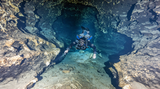 Diver using Halcyon Photon light in a cave