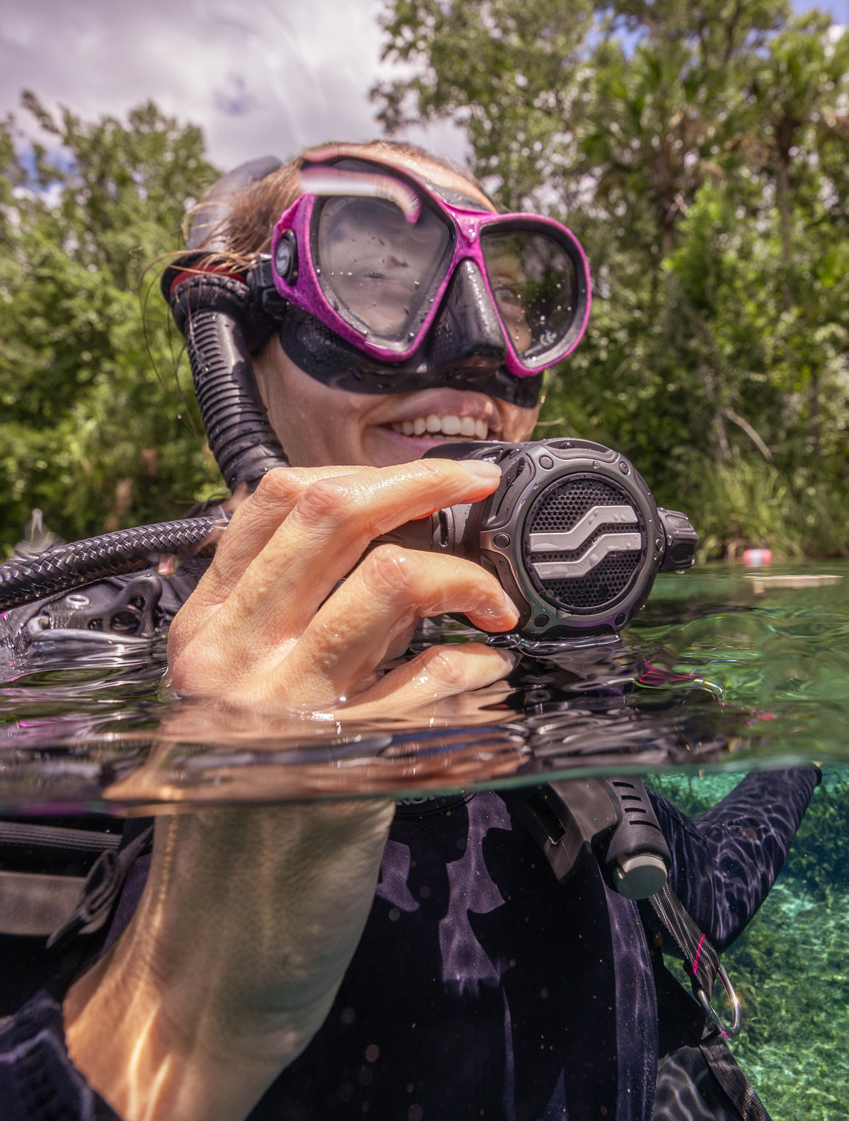 Diver at the surface holding the Sherwood SR3 Regulator second stage